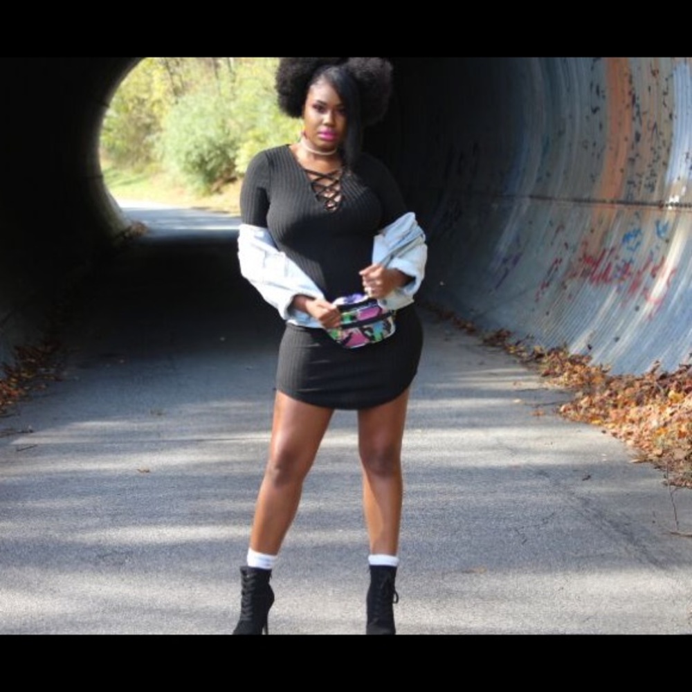 Black dress. Lace up plunge neckline